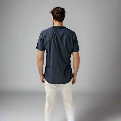 Jorge rear shot wearing sand GTO pants and casual shirt
